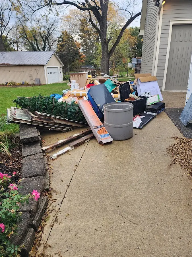 Dumpster being loaded with debris for 3 Yard Dumpster Rental in Lower Oxford